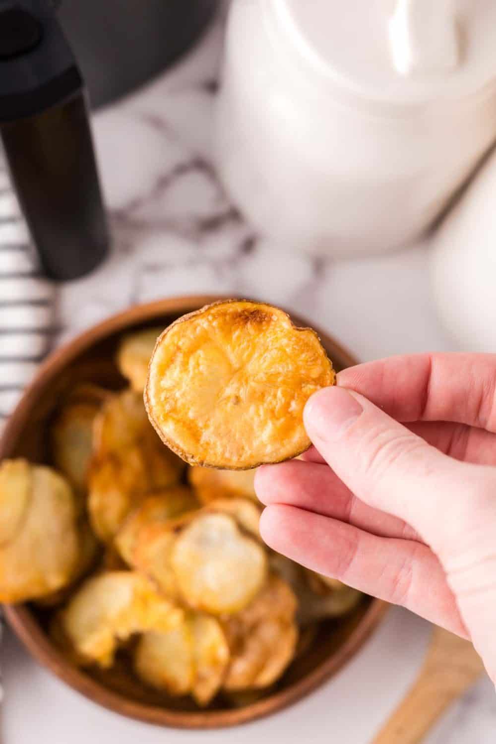 air fried potato chips in a wooden bowl.