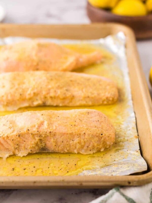 baked salmon over tin foil on a baking sheet.