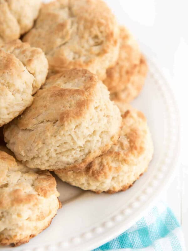 stack of butter biscuits on a white plate