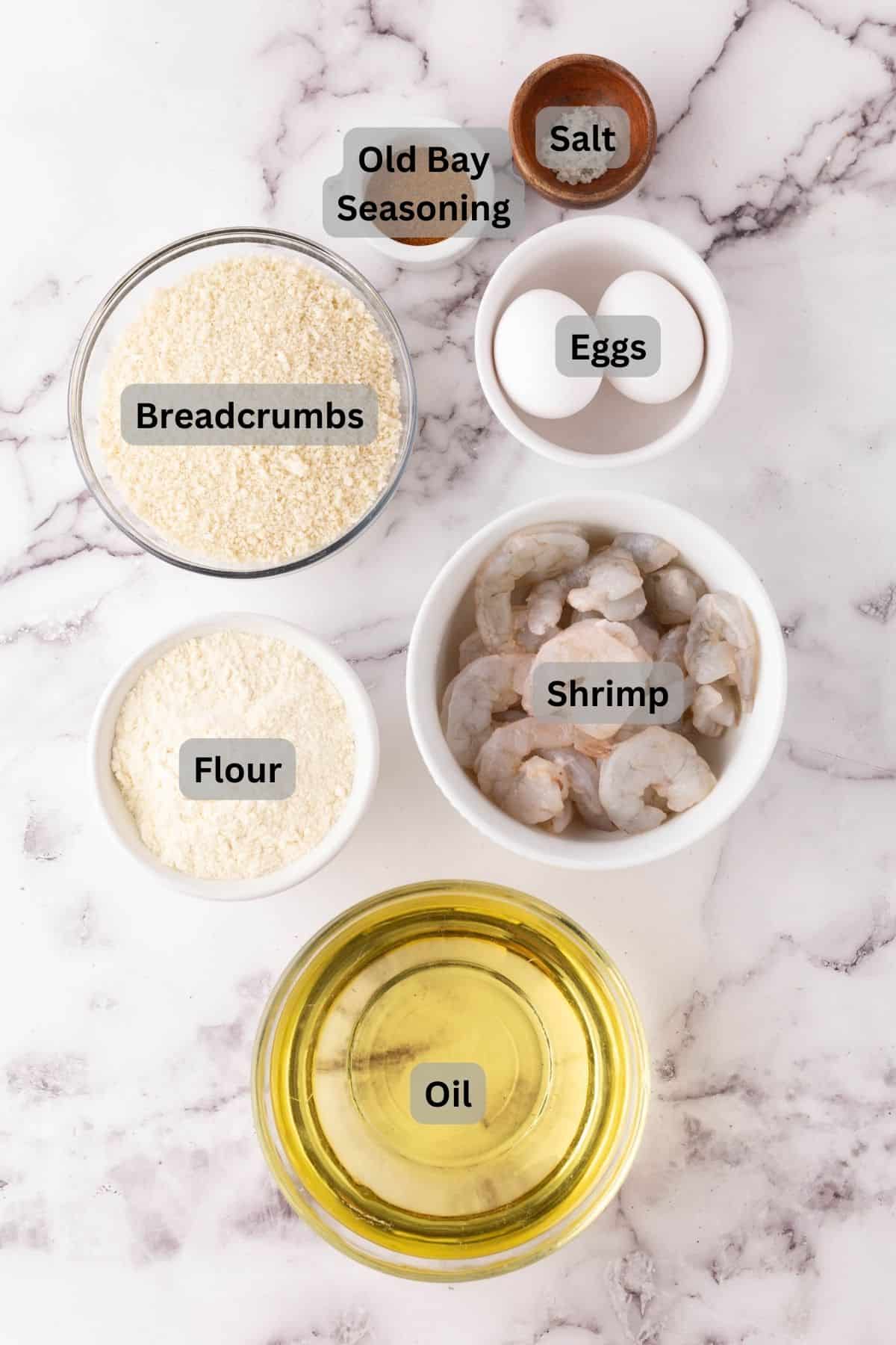 portion bowls each with digitally labeled raw ingredients to make butterfly shrimp.