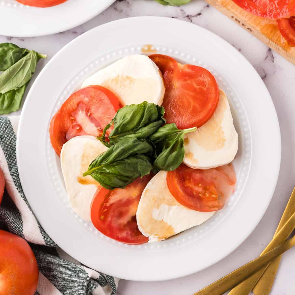 Caprese Salad on a round plate.