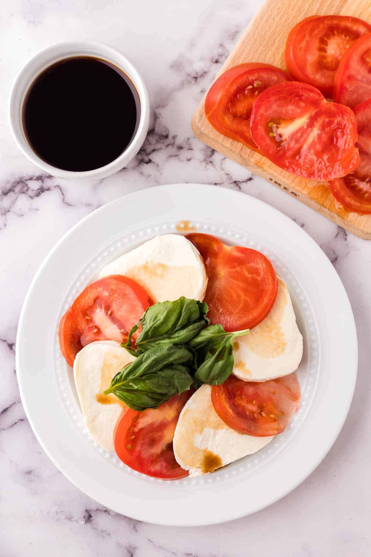 small white plate for caprese salad recipe.