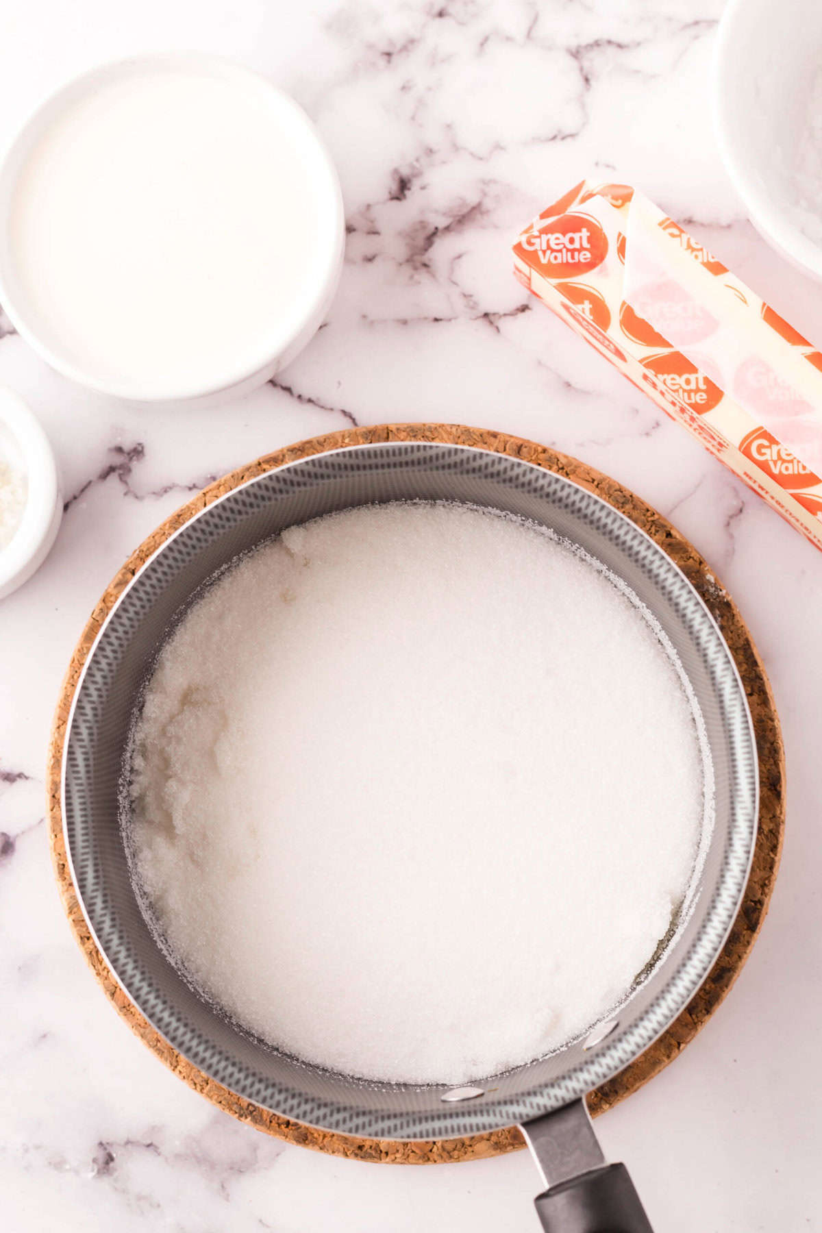 sauce pan with ingredients to make homemade caramel sauce.