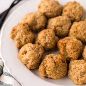 chicken meatballs on a round white plate.