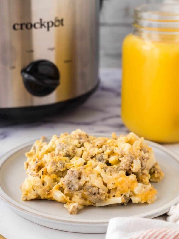 crockpot breakfast casserole with orange juice in the background