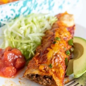 dinner plate with a photo of a homemade beef enchilada