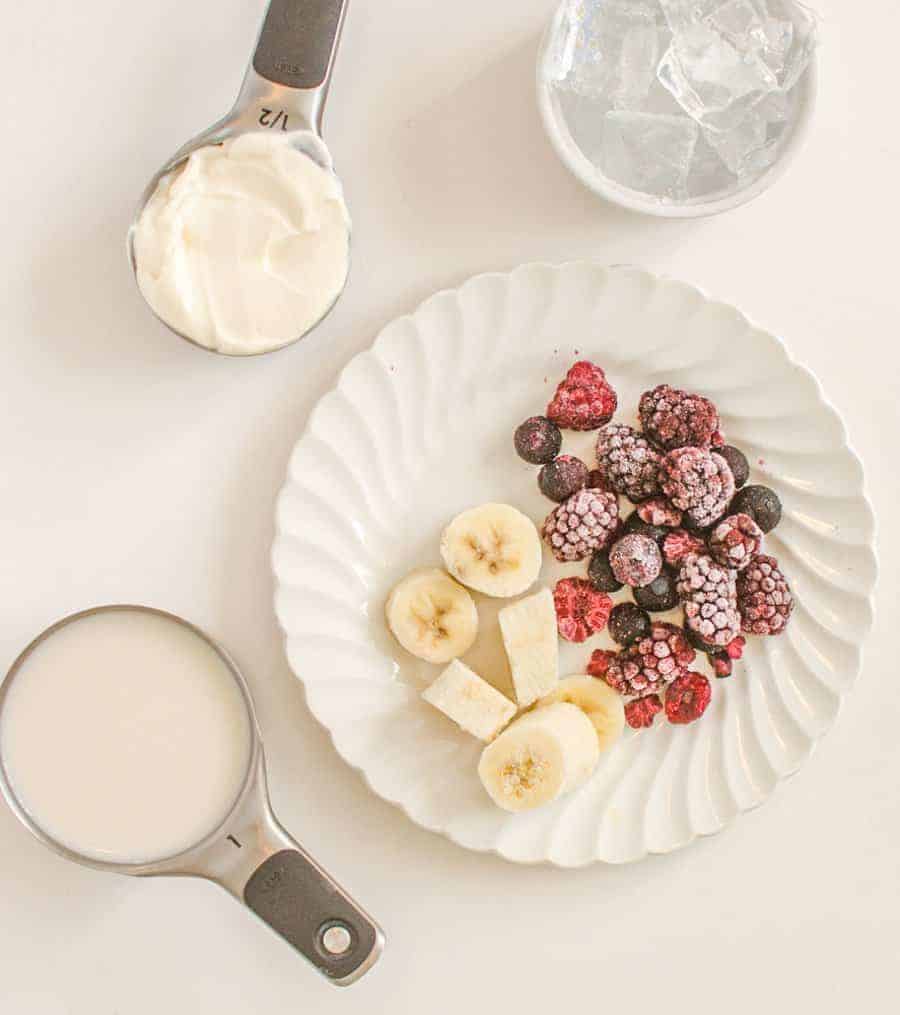 bananas and mixed berries in a smoothie.