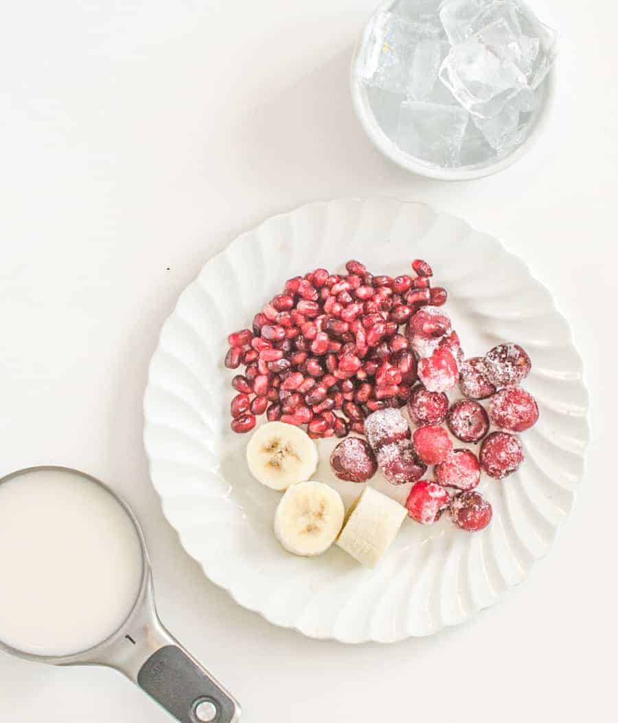 pomegranates bananas and cranberries for smoothie.