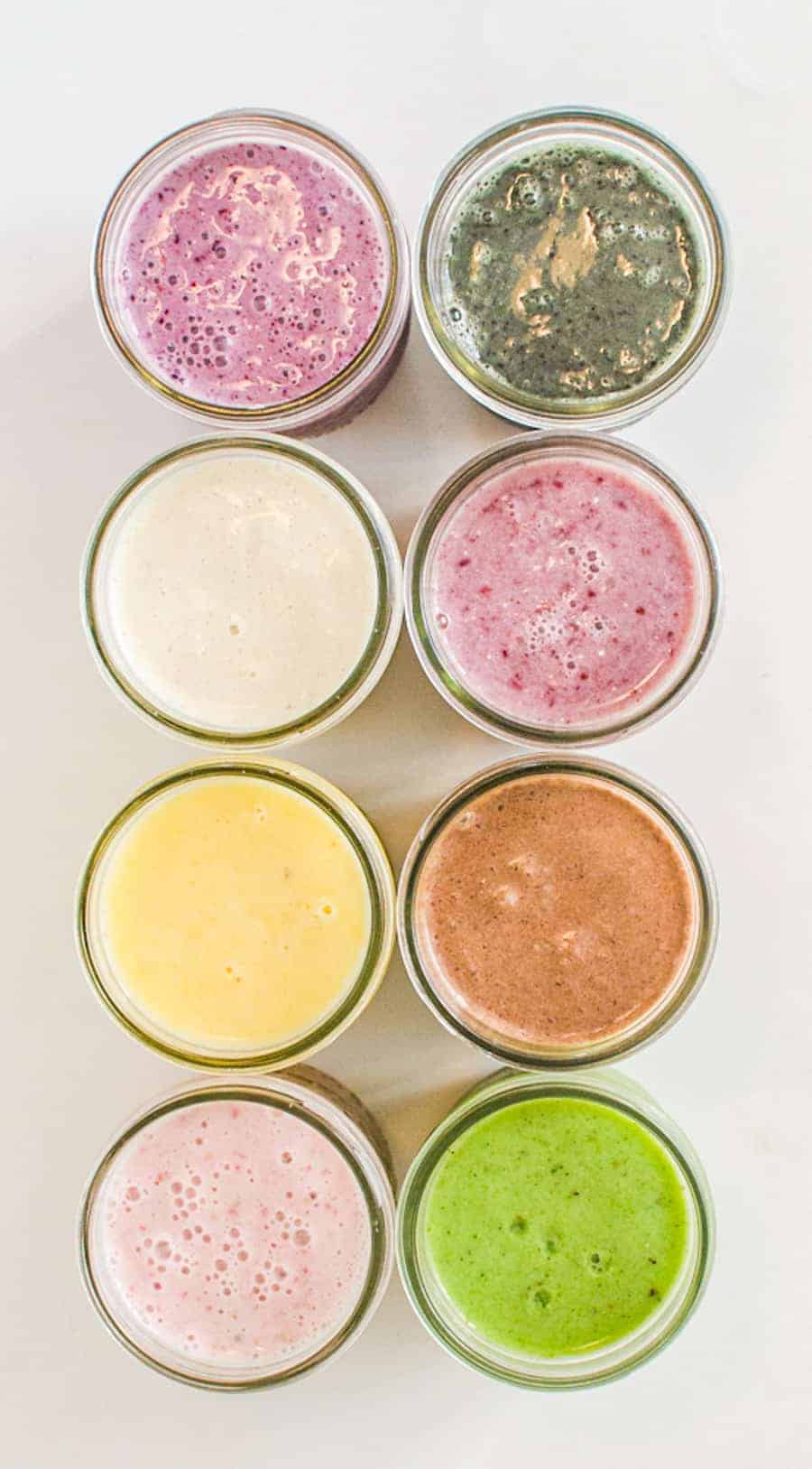 top view of 8 mason jars with smoothies.