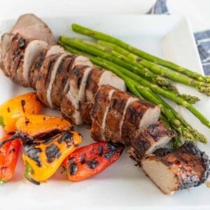 Brown Sugar and Garlic Grilled Pork Tenderloin is robust and smoky with a nice sweet-to-savory ratio. Fire up the grill because this is your new go-to summertime barbecue meat.