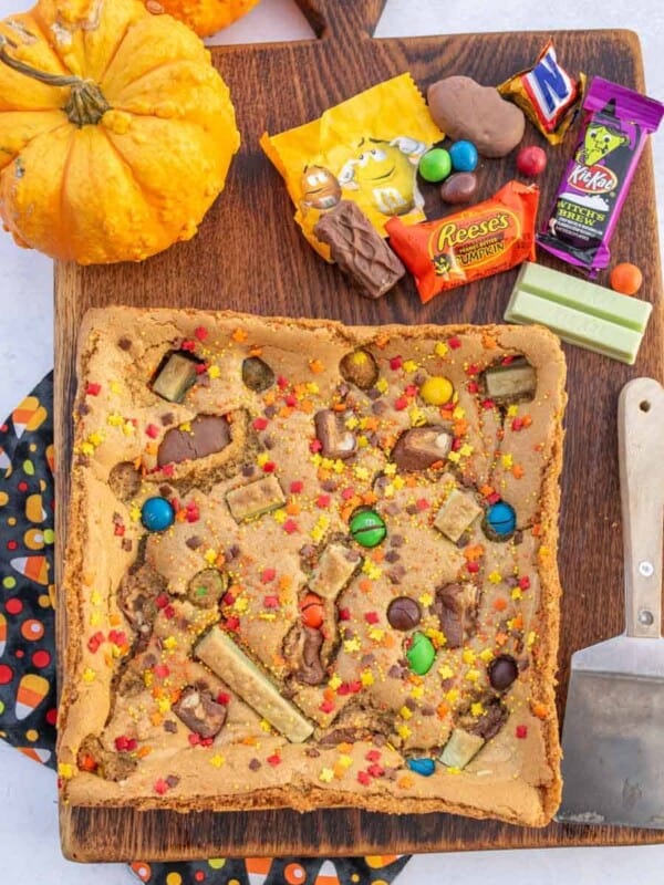 uncut cookie bars on a cutting board