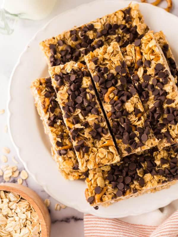 a round plate with rectangle strips of homemade granola bar recipe with chocolate chips on top.