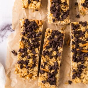 rectangle pieces of the homemade granola bar recipe over parchment paper.