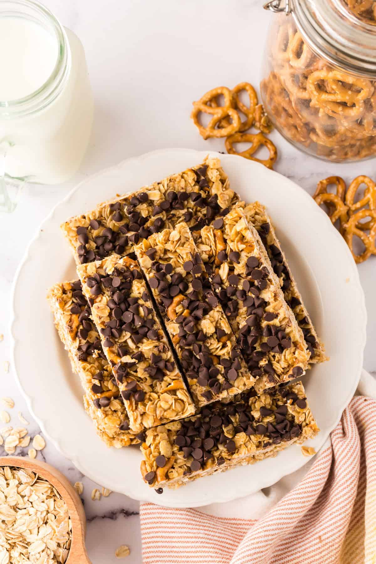 a round plate with rectangle strips of homemade granola bar recipe with chocolate chips on top.