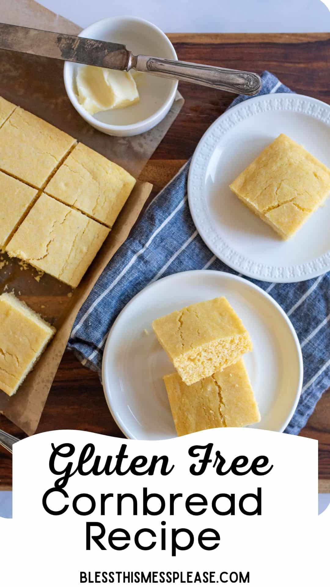 Top view of sliced gluten-free cornbread on a wooden board with a ramekin of butter and a butter knife. Two white plates hold additional pieces of cornbread, all placed on a blue cloth. Gluten Free Cornbread Recipe text is at the bottom.