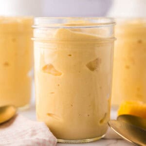 Mango lassi in glass mason jars.