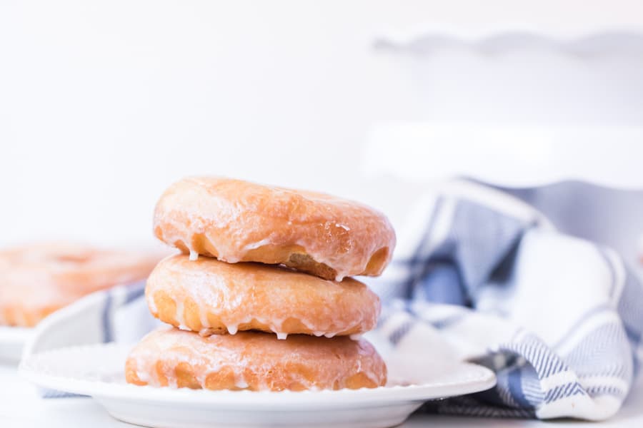 Stack of homemade glazed donuts.