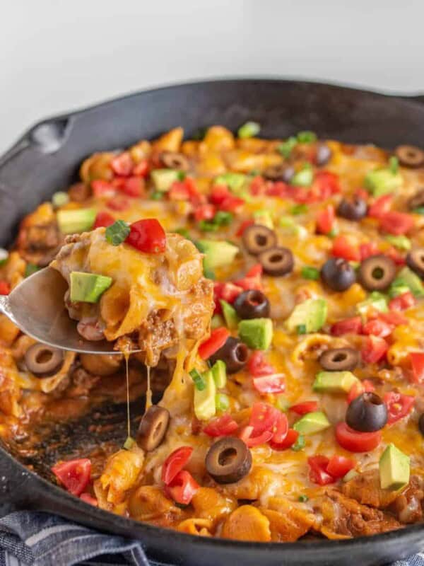 Cheesy, creamy, and packed with shell noodles, ground beef, lots of tomatoes, and all your favorite Tex-Mex toppings, one-pot Skillet Taco Pasta is as dreamy as it is filling and flavorful.