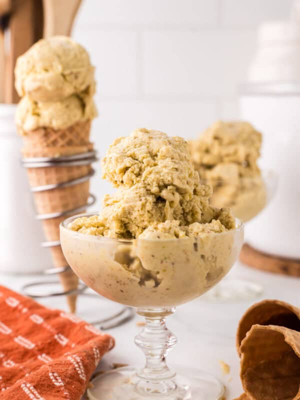 pistachio gelato in a steamed fancy glass dish.