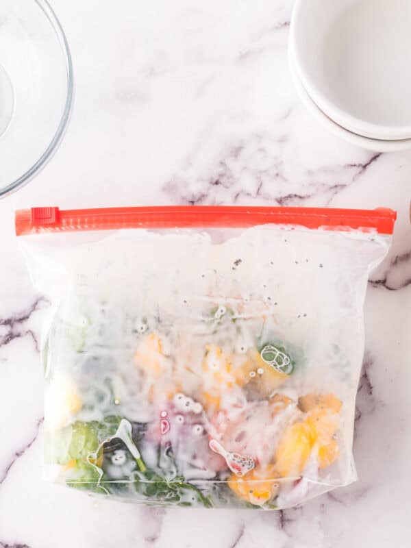 Prepared frozen smoothie bag enclosed on a counter.