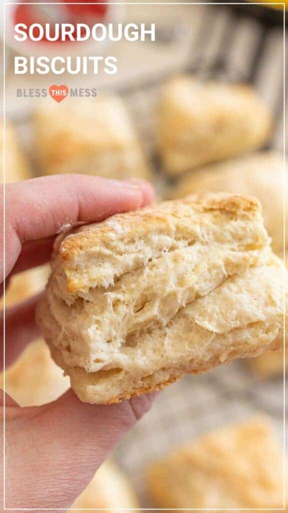 woman holding sourdough biscuit.