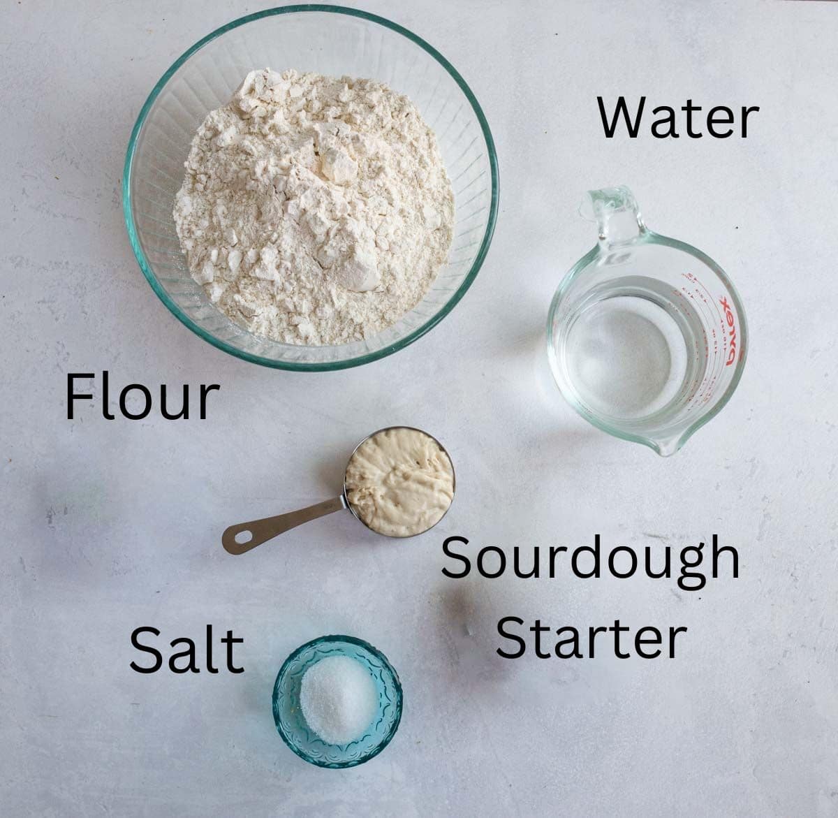 labeled ingredients for no knead sourdough bread.