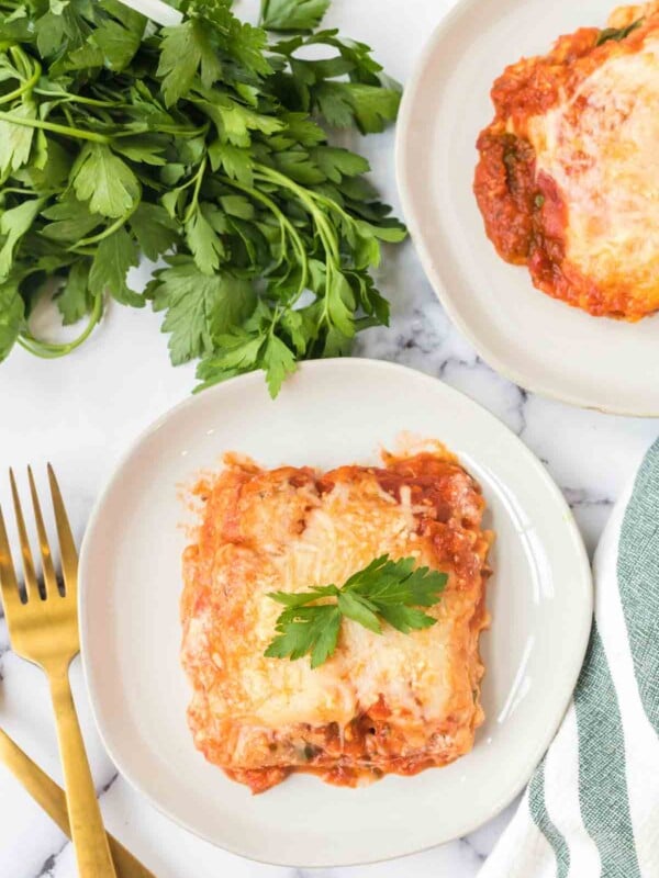 top view of one square serving of lasagna on a white plate