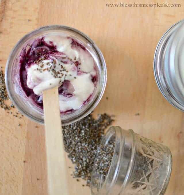 Top view of a yogurt cup with chia seeds and fruit jam. 