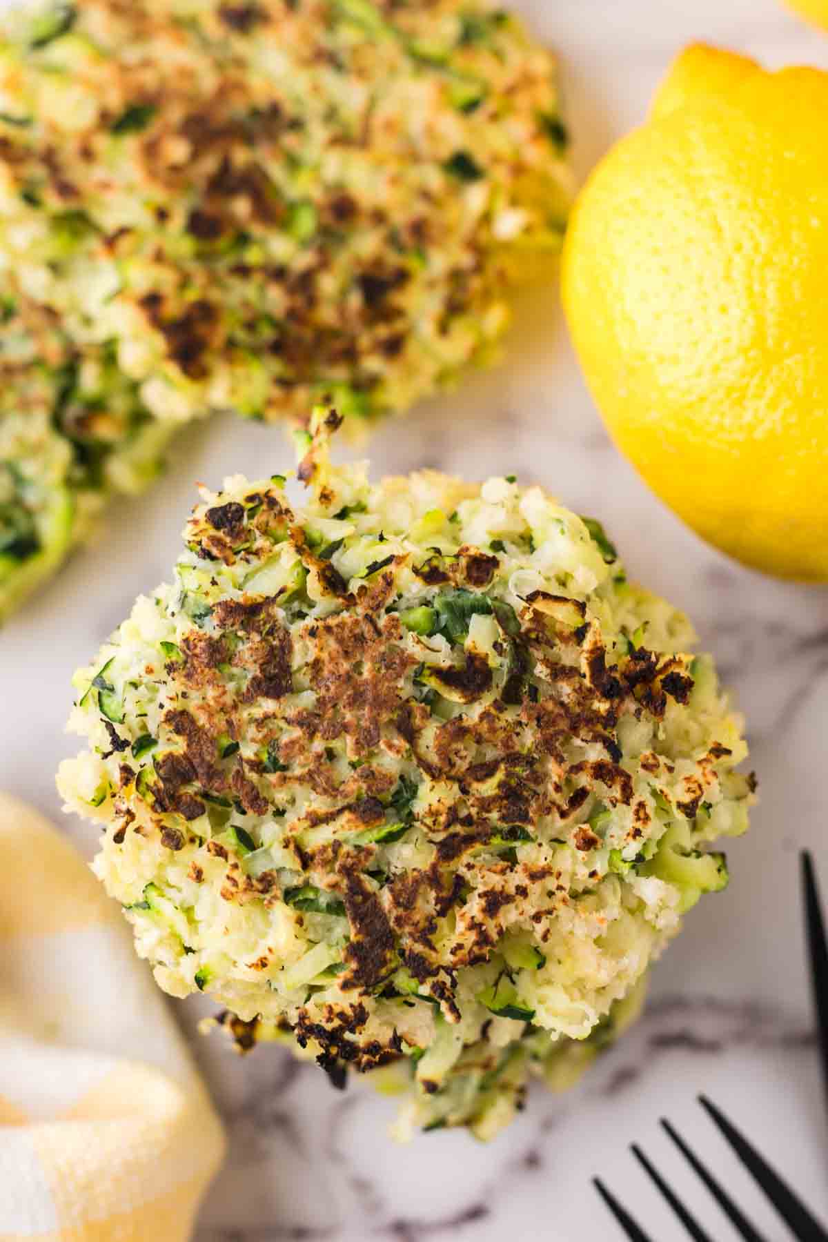 stack of four zucchini fritters.